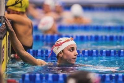 Swimmers Wear Parkas And Mittens To Stay Warm Before Races.