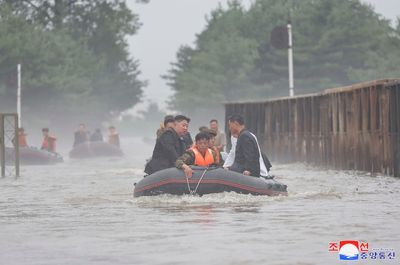 North Korean leader accuses South Korea of a smear campaign over floods and hints at rejecting aid