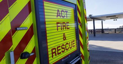 Firefighters cut through car to rescue person in T-bone crash