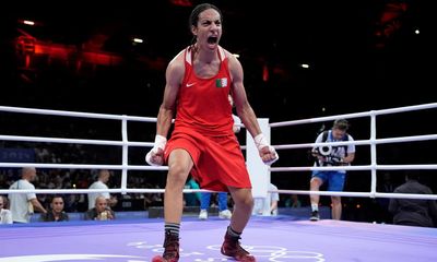 Algerian boxer at centre of gender row sheds tears after quarter-final victory