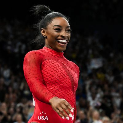 Simone Biles Wins Her 7th Olympic Gold Medal in "Power Color" Red Leotard Featuring 3,600 Swarovski Crystals