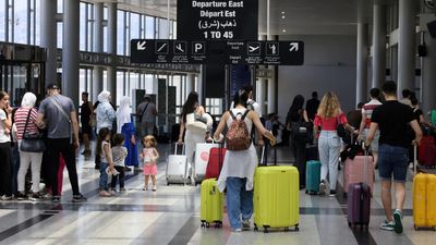 Travellers queue at Beirut airport as countries issue warnings over Middle East tensions