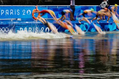 Belgium withdraw from triathlon relay as athlete falls ill after swimming in Seine