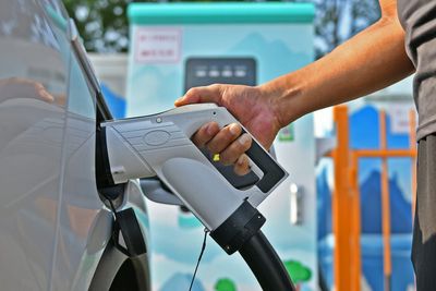 An EV charging company will penalize drivers who take more than they need