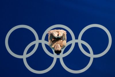 One Extraordinary (Olympic) Photo: Lee Jin-man captures diver at the center of the Olympic rings