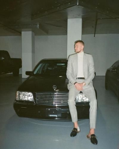 Kristaps Porzingis Exudes Sophistication In Stylish Suit And Classic Car