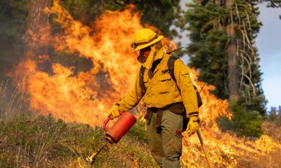 Fast-moving California wildfire destroys homes and burns at least 100 acres