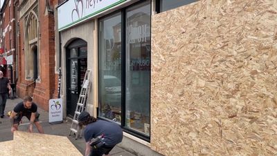 London businesses boarded up and to close early amid fears of riots