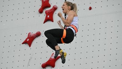 Up beat: Miroslaw wins Olympic gold for Poland in speed sports climbing