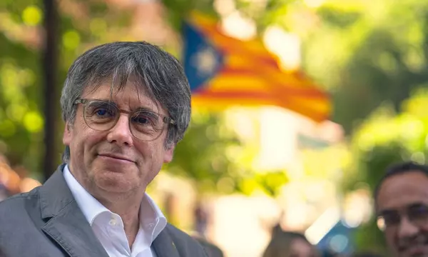 Carles Puigdemont vows to return to Spain in headache for ruling coalition