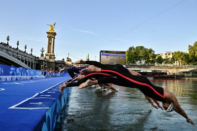 Olympic Swimmers Plunge Into Seine, Lyles Eyes Sprint Double