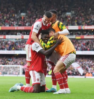 Celebratory Team Hug Captures Victory And Team Spirit On Field