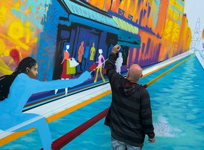 Street art pops up throughout Paris, adding some Olympic color to major landmarks