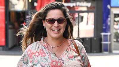 Kelly Brook's delightful boho floral dress, wedge sandals and cat-eye sunglasses is a winning combination for summer style