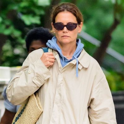 Katie Holmes Styles Up Her Khaki Rain Jacket With a Straw Tote and $300 Sneakers