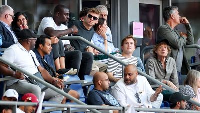 Swimming Rock Star Léon Marchand, Actual Rock Star Mick Jagger Take in Olympic Track