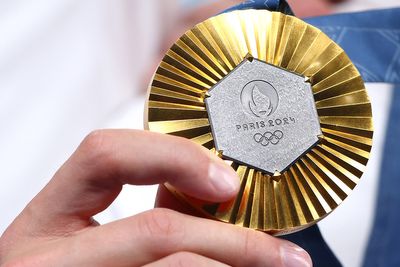 What does the gold-medalist in women’s golf receive at the Paris Olympics besides the medal?