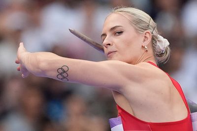 AP PHOTOS: The Olympic rings are everywhere -- even on some athletes