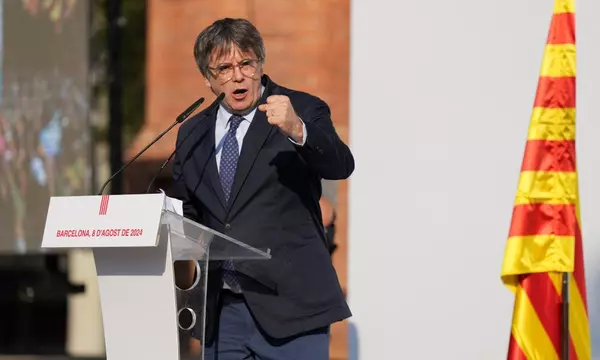 Carles Puigdemont no longer in Spain and will not give himself up, lawyer says