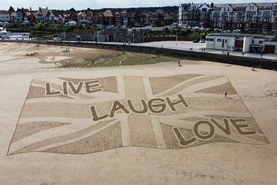 ‘Live, laugh, love’ sand sculpture created in response to far-right riots sparks barrage of jokes