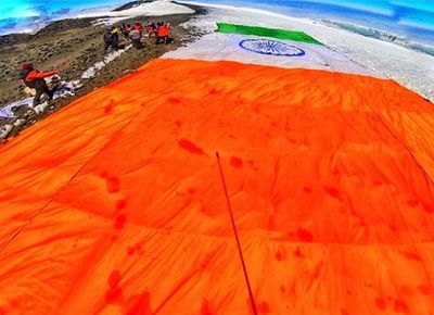 Differently-abled mountaineers of HMI display Tricolour at Mt Kilamanjaro in Africa