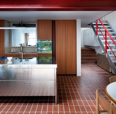 Brick floors and white tiles revive an East London house