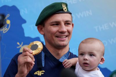 Oleksandr Khyzhniak, Ukraine's gold medal-winning boxer, returns home and lifts spirits amid war