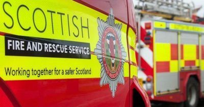 Emergency services tackle blaze in Scottish city as road remains closed