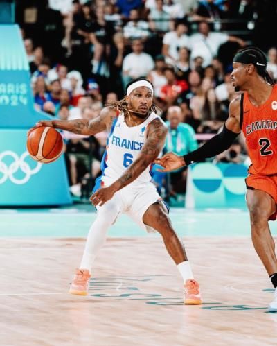 Team USA Maintains Lead Over France In Tense Basketball Match