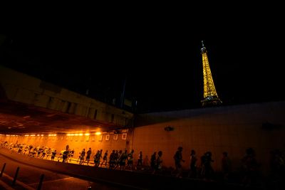 Amateur runners race like Olympians along the same iconic route as competitors in Paris