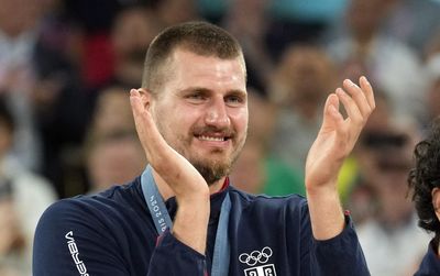 A wobbly Nikola Jokic delightfully received his Olympic bronze alongside his Serbian teammates