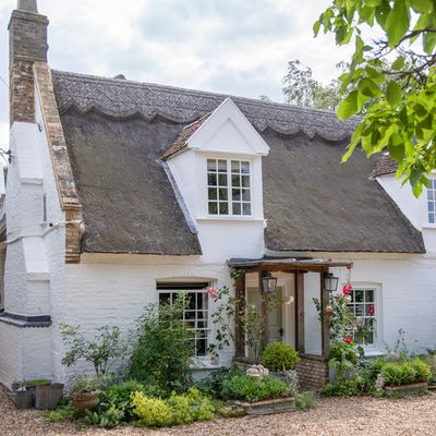 This pretty thatched cottage is full to brimming with vintage finds