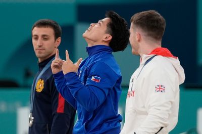 Filipino gymnast who won 2 Olympic golds in Paris gets hero's welcome and free buffets for life