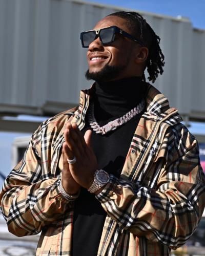 Joe Mixon's Effortlessly Stylish Black Outfit And Confident Pose