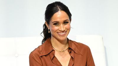 Meghan Markle stuns in bronze shirt and satin wide leg trousers in Colombia - we’re adding metallic shades into our style rotation