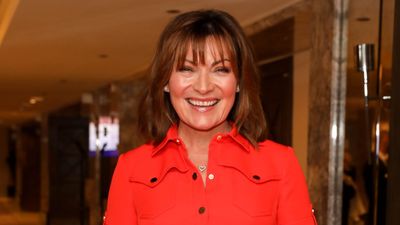 Lorraine Kelly just wore the most flattering puff sleeve, vibrant orange dress off the high street - and it's on sale today