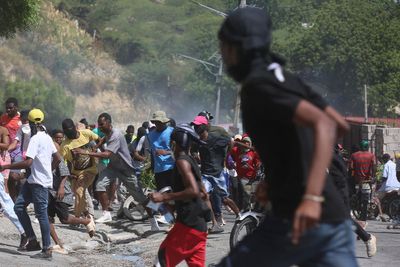 Haitian police tear-gas peaceful protesters as they demand help in stopping gangs