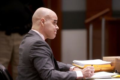 Jury hears ex-politician on trial for murder amassed photos, ID records about slain Vegas reporter