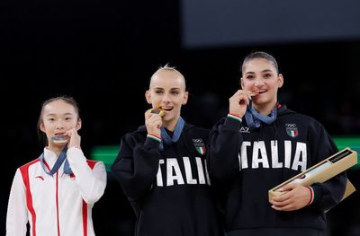 Chinese Olympic medallist returns from Paris to wait tables at family restaurant