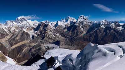 Watch Brit daredevil set new BASE jumping world record skiing off a Himalayan cliff