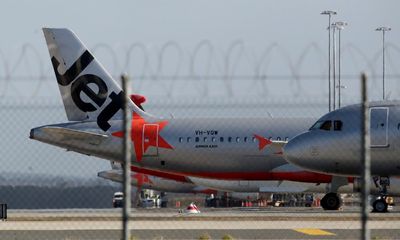 Jetstar passenger arrested on Melbourne airport tarmac after opening plane door and walking on wing