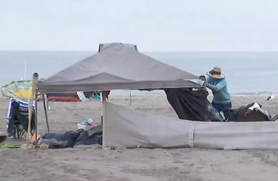 LA County workers and local law enforcement clear homeless encampment at Dockweiler State Beach