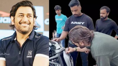 MS Dhoni wins hearts again, signs fan's bike in a heartwarming gesture - WATCH