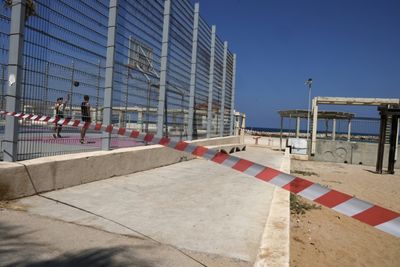 Israeli Beachgoers Try To Brush Off Hezbollah Threat