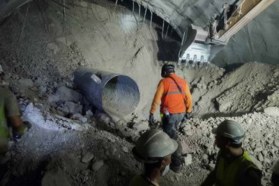 Signs of life as tunnel rescuers near trapped men