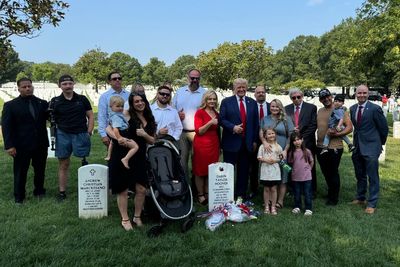 Trump slammed for flashing smile and making ‘disgraceful’ thumbs up at soldiers’ graves