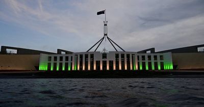 Parliament House lights up green and gold for the Paris Paralympics