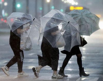 Typhoon lashes Japan with torrential rain and strong winds on a slow crawl north