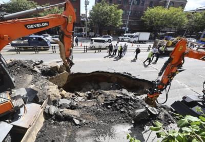 Sinkhole Swallows SUV In Seoul, Injuring Two Occupants