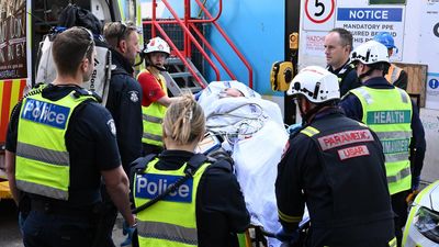 Naked man wields knife while scaling tunnel site